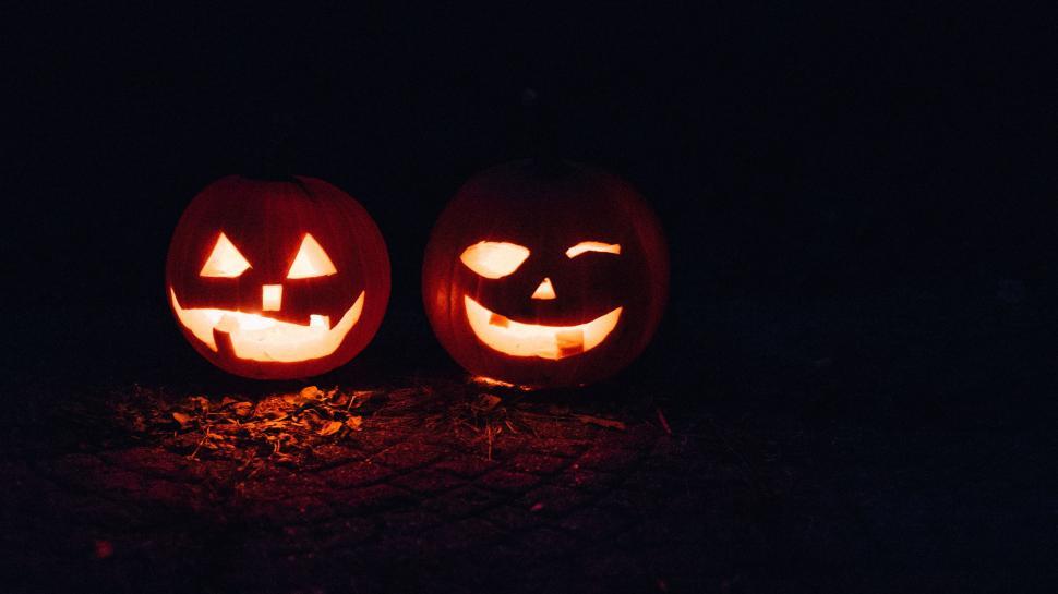 Free Image of Two Carved Pumpkins on a Table 