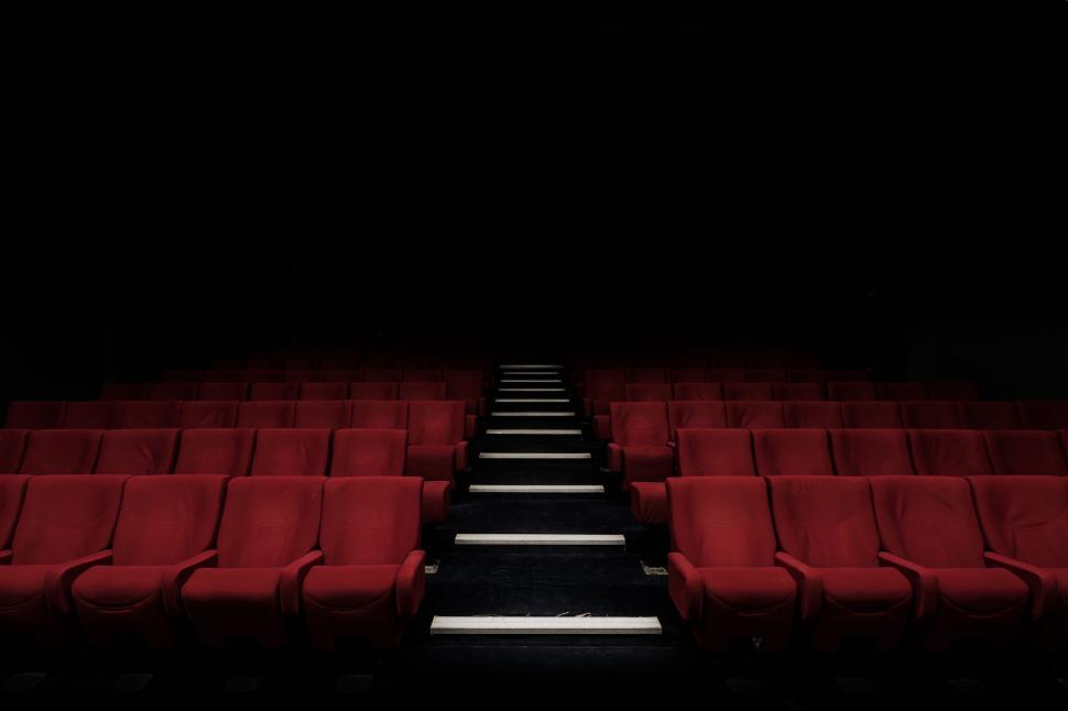 Free Image of Row of Red Seats in Dark Auditorium 