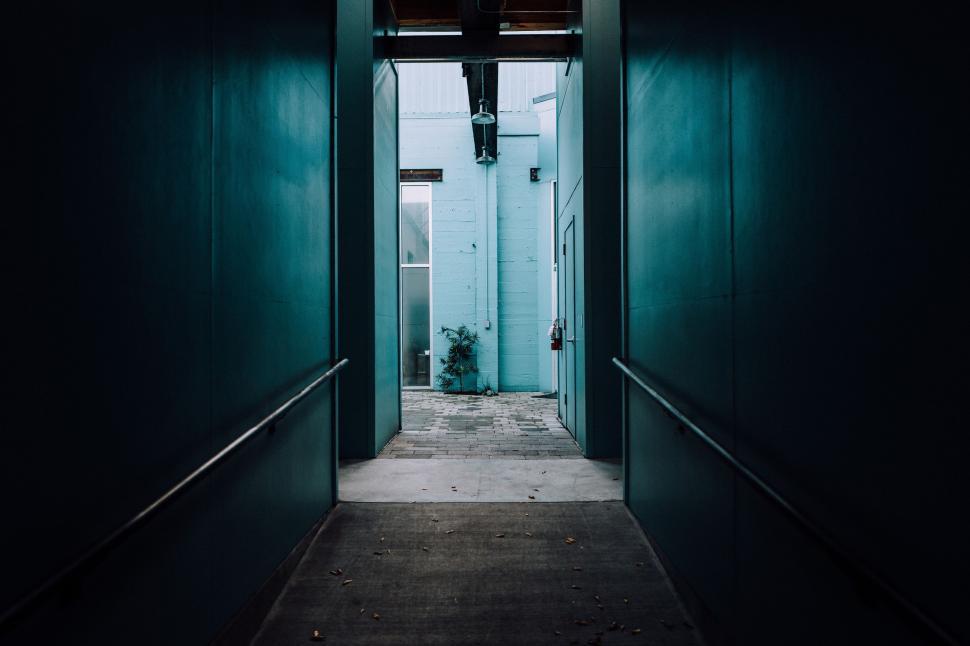 Free Image of Dark Hallway With Light at the End 