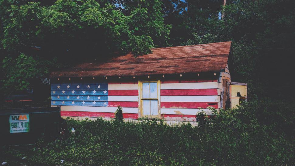 Free Image of Small Cabin With American Flag 