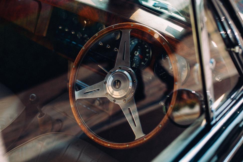 Free Image of Close Up of a Steering Wheel on a Car 