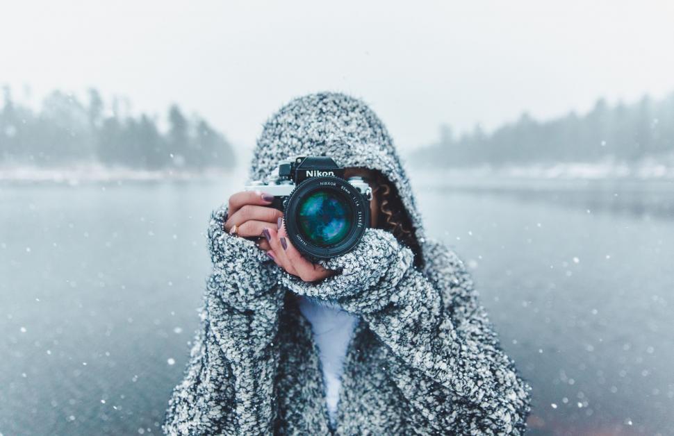 Free Image of Person Taking Picture With Camera in Snow 