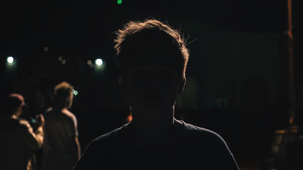 Free Image of Man Standing in the Dark at Night 