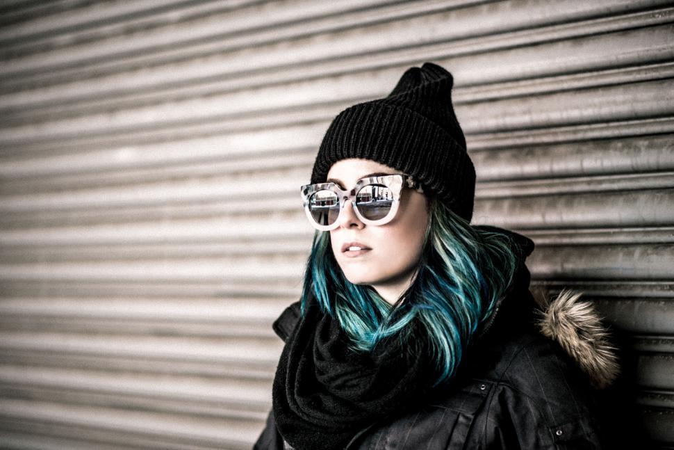 Free Image of Woman With Blue Hair Wearing Sunglasses and Black Jacket 