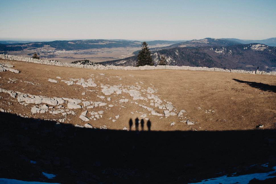Free Image of Group of People Standing on Snow-Covered Hillside 