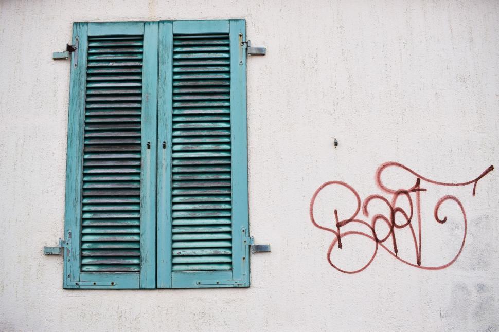 Free Image of Wall With a Window and Graffiti 