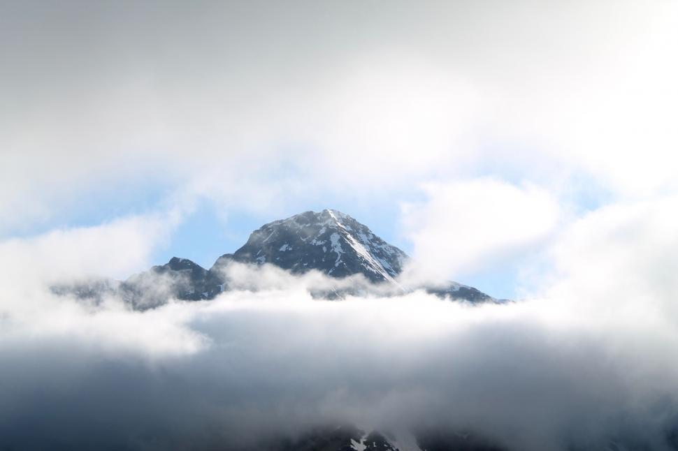 Free Image of Cloud-Covered Mountain Against Sky Background 