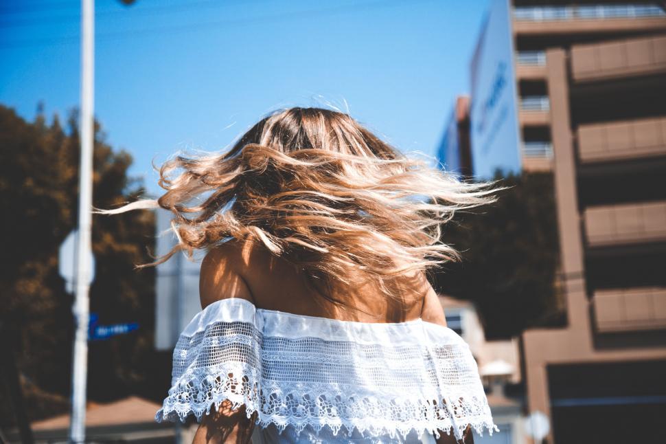 Free Image of Woman With Hair Blowing in the Wind 