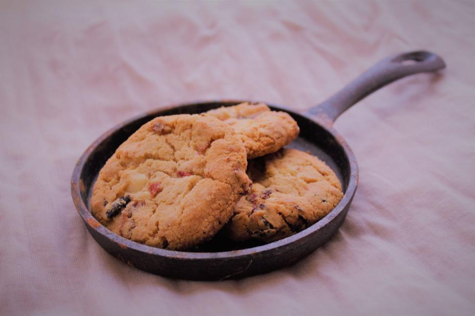 Free Image of Two Cookies in a Frying Pan on a Table 