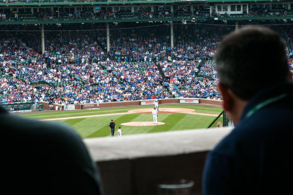 Free Image of A Crowd of People Watching a Baseball Game 