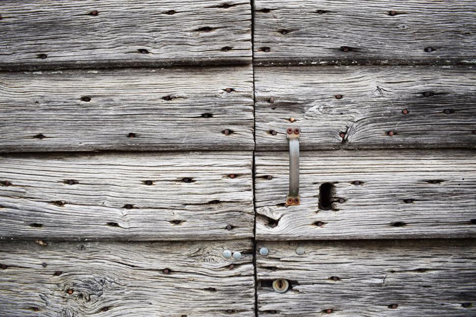 Free Image of Close Up of Wooden Door With Nails 