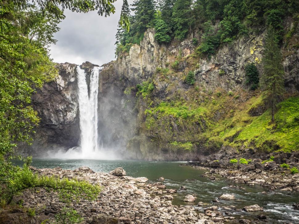 Free Image of Majestic Waterfall Cascading Down Rocks 