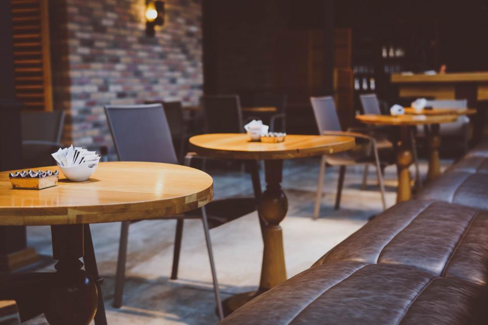 Free Image of Row of Tables and Chairs in a Restaurant 
