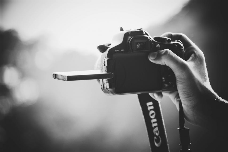 Free Image of Person Holding Camera in Hand 