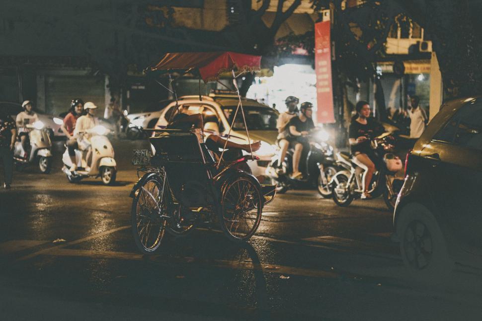 Free Image of Group of People Riding Motorcycles Down a Street 