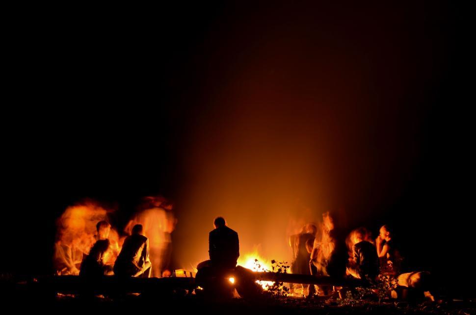 Free Image of Group of People Standing Around a Fire 