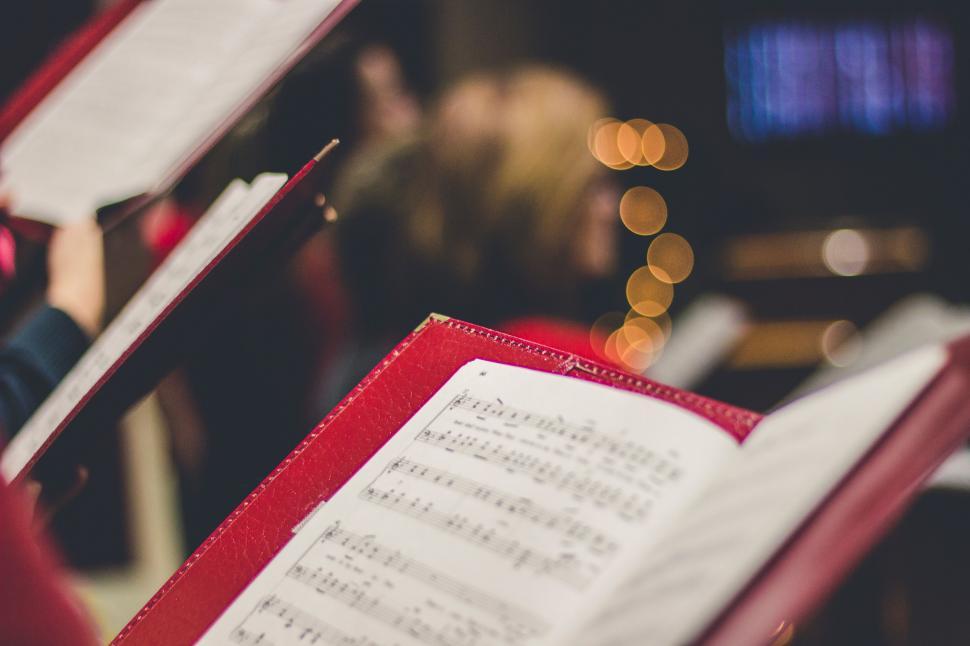 Free Image of Close Up of a Red Book With Sheet Music 