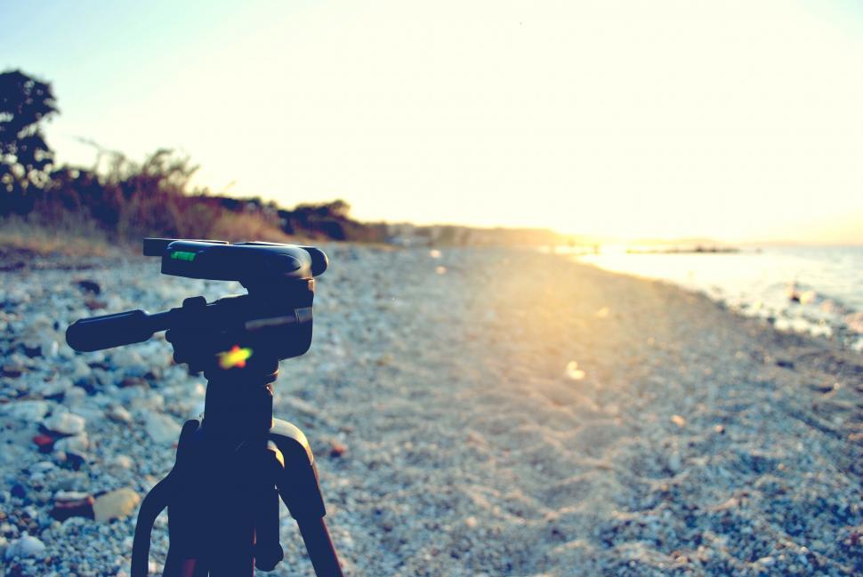 Free Image of Camera on Tripod Capturing Beach Scene 