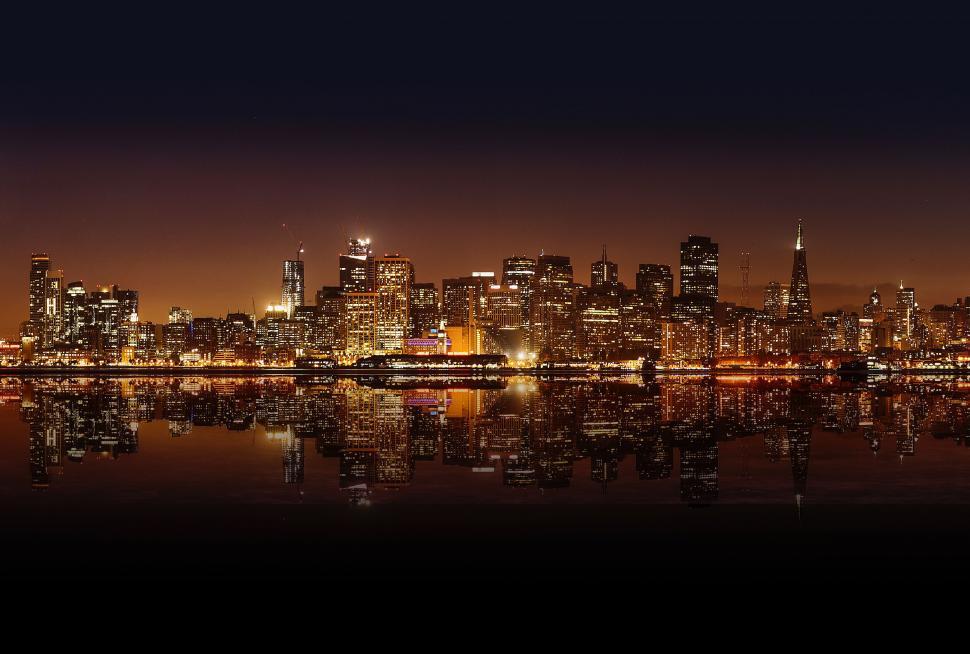 Free Image of city waterfront urban skyline building architecture cityscape night river water buildings travel sky manhattan tourism downtown tower landmark skyscraper reflection boat panorama town evening harbor bridge europe modern famous landscape sunset 
