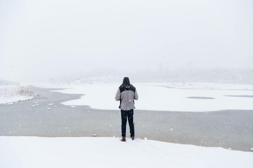Free Image of Person Standing on Snow Covered Field 