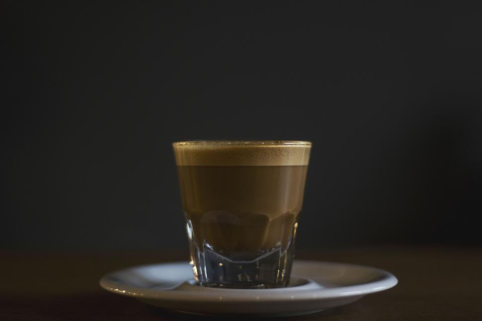 Free Image of A Cup of Coffee on a White Plate 