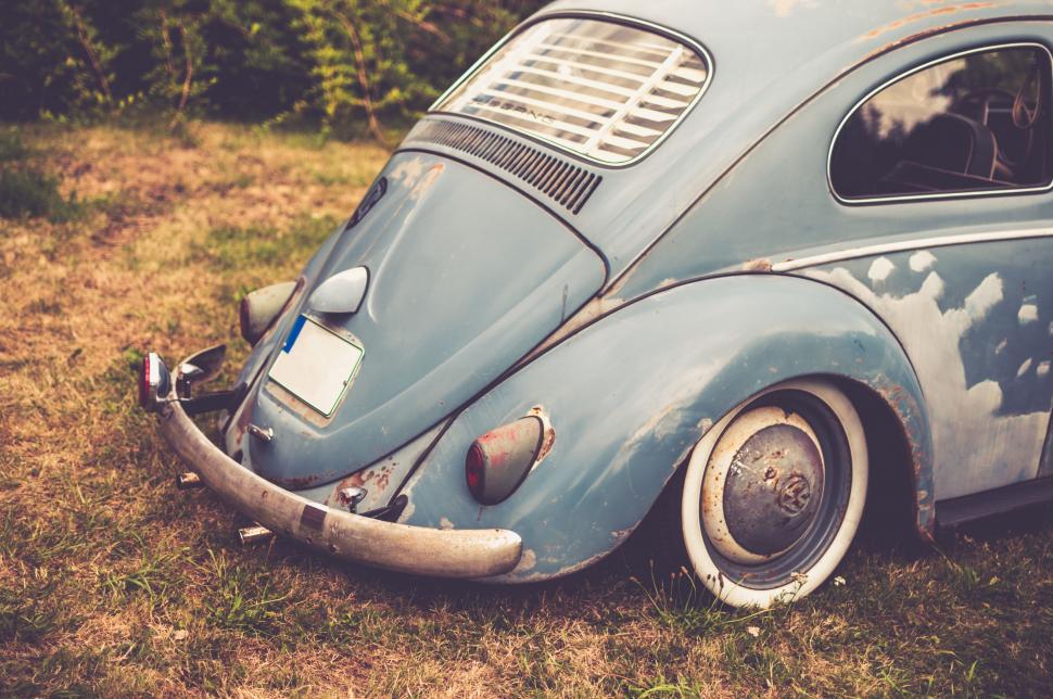 Free Image of Old Blue VW Bug Parked in Field 