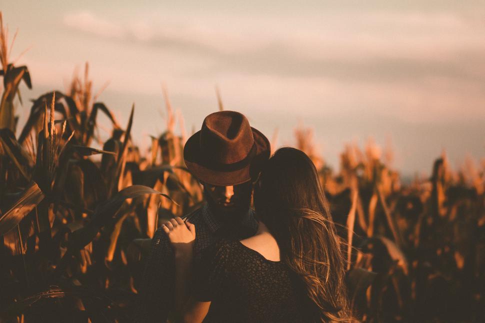Free Image of Woman in Hat Standing in Corn Field 