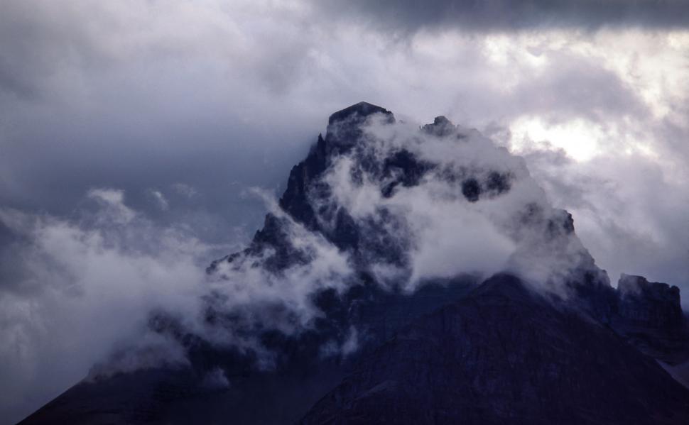 Free Image of Cloud-Covered Tall Mountain Under Cloudy Sky 