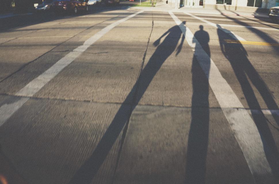 Free Image of Silhouette of Person Walking Across Street 