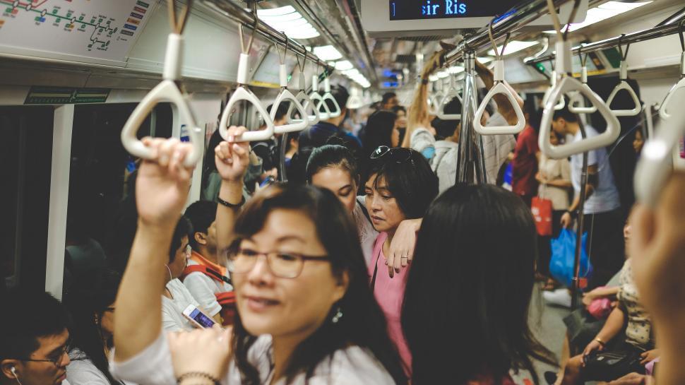 Free Image of Group of People Riding on a Subway Train 