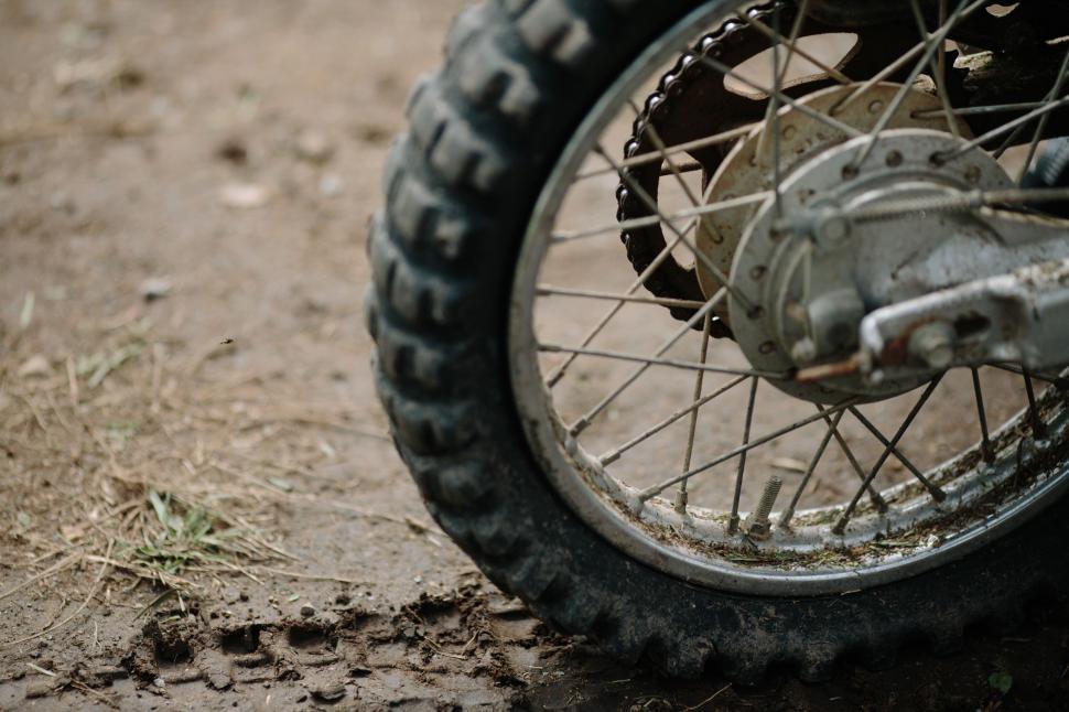 Free Image of Close Up of Motorcycle Tire on Dirt Road 