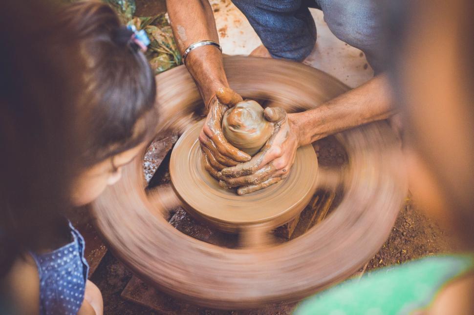 Free Image of Person Making a Pot on a Potters Wheel 