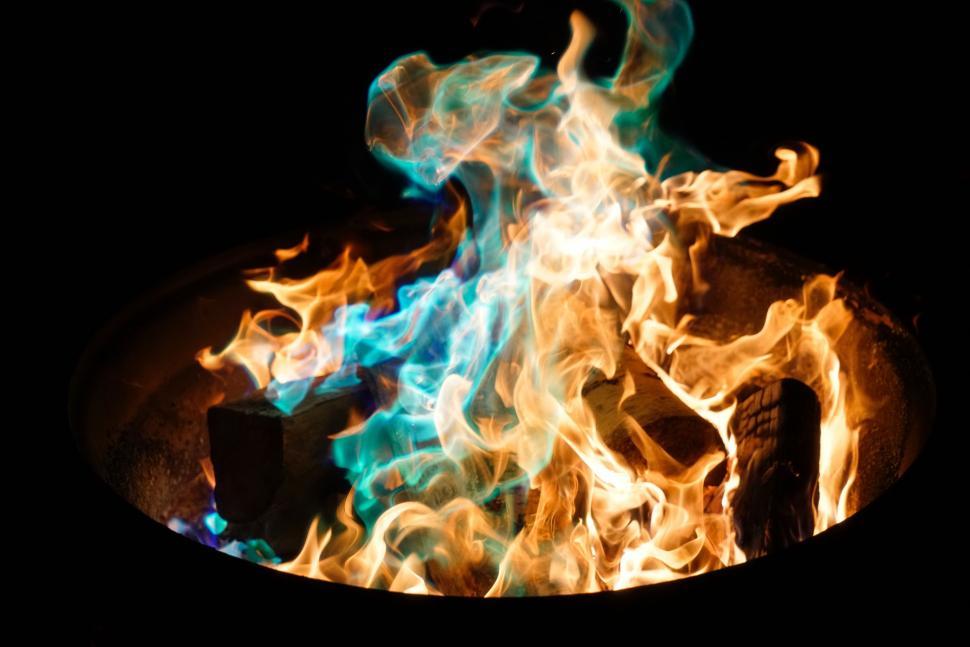 Free Image of Fiery Fire Pit With Blue and Orange Flames 