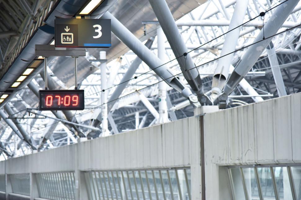 Free Image of Train Station With Hanging Ceiling Signs 