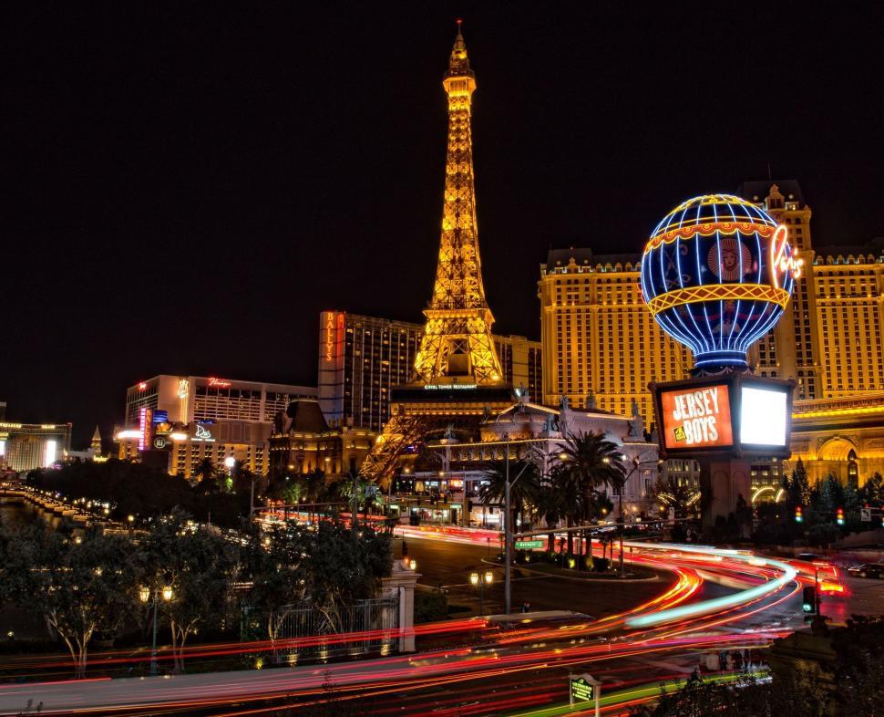 Free Image of The Las Vegas Strip at Night With Eiffel Tower in Background 
