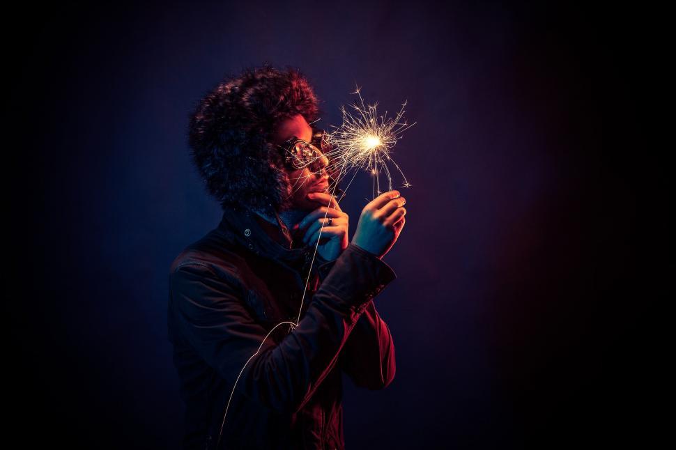 Free Image of Man Holding Sparkler in Hand 