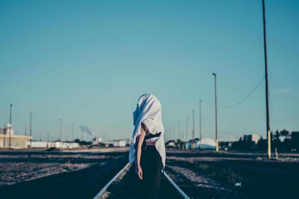 Free Image of Person Standing on Train Track in the Middle of the Day 