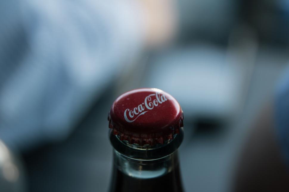 Free Image of Close Up of Coca-Cola Bottle With Blurry Background 