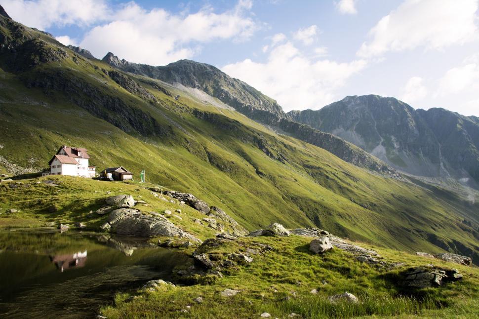 Free Image of House in the Middle of Mountain Range 