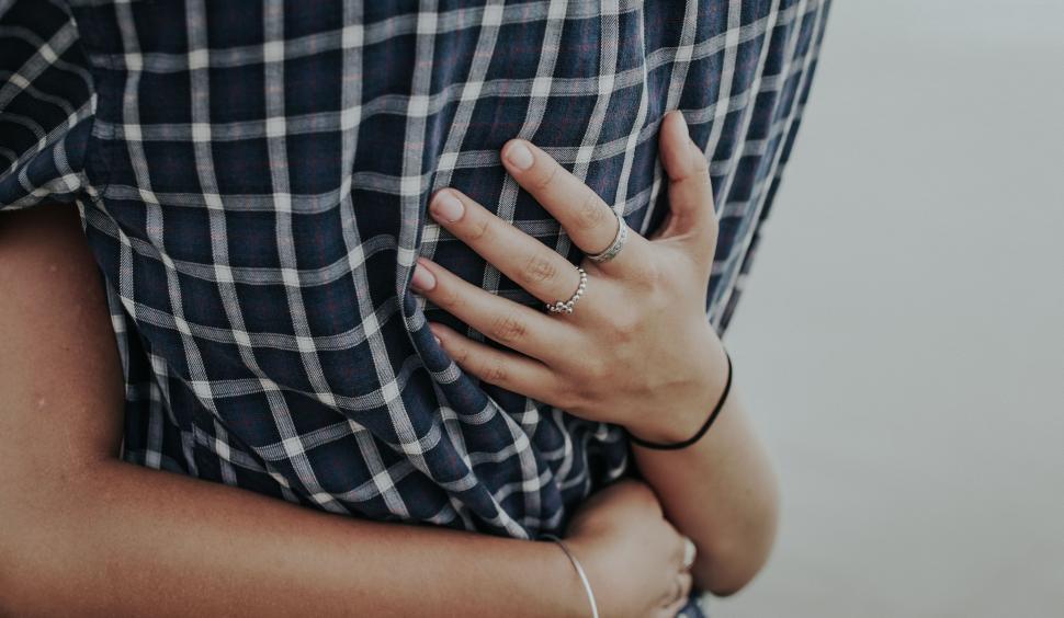 Free Image of Woman With Her Hands on Her Chest 