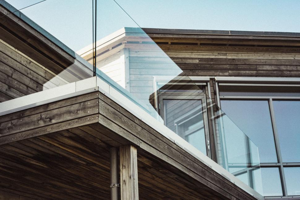 Free Image of Wooden House With Glass Roof and Metal Handrail 