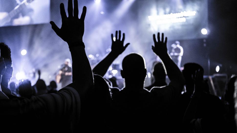 Free Image of Excited Crowd Raising Hands at Concert 