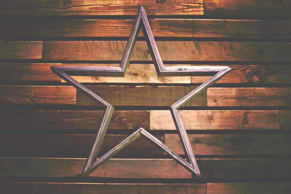 Free Image of Wooden Wall With Metal Star Decoration 
