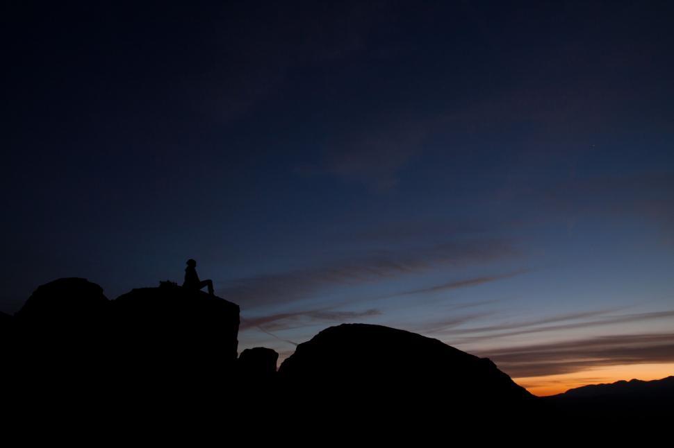 Free Image of Person Standing on Mountain Top at Night 