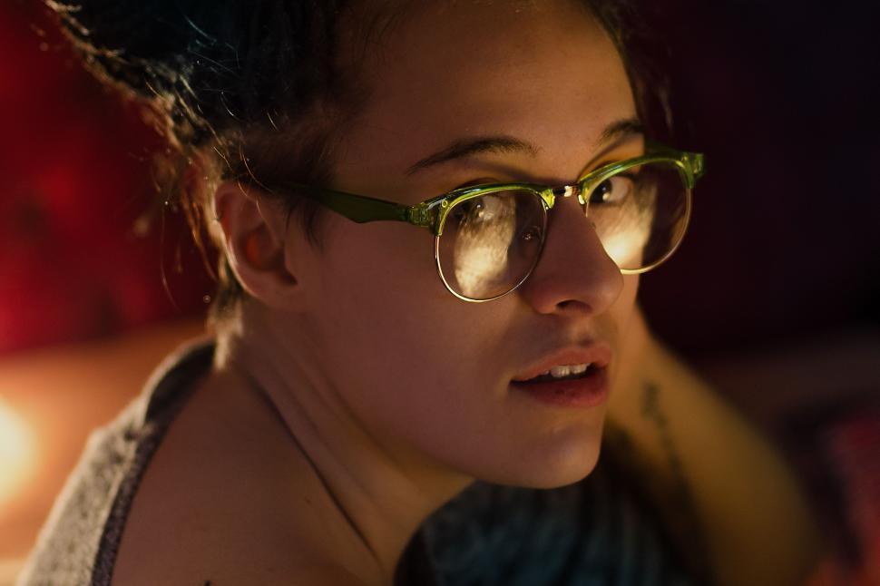 Free Image of Woman Wearing Glasses Observing Distant Object 