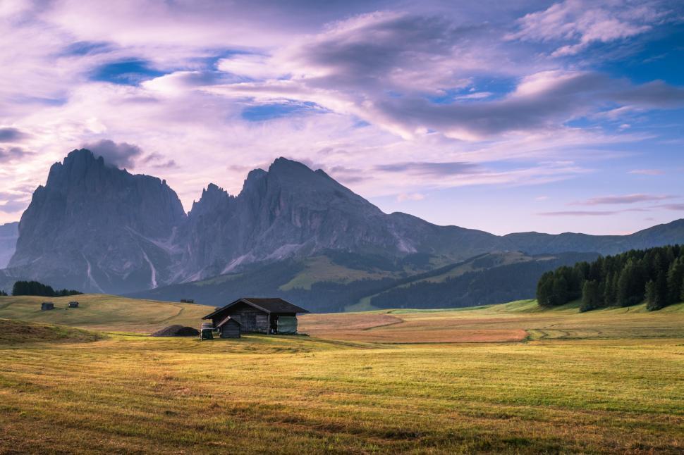 Free Image of House in Field With Mountains 