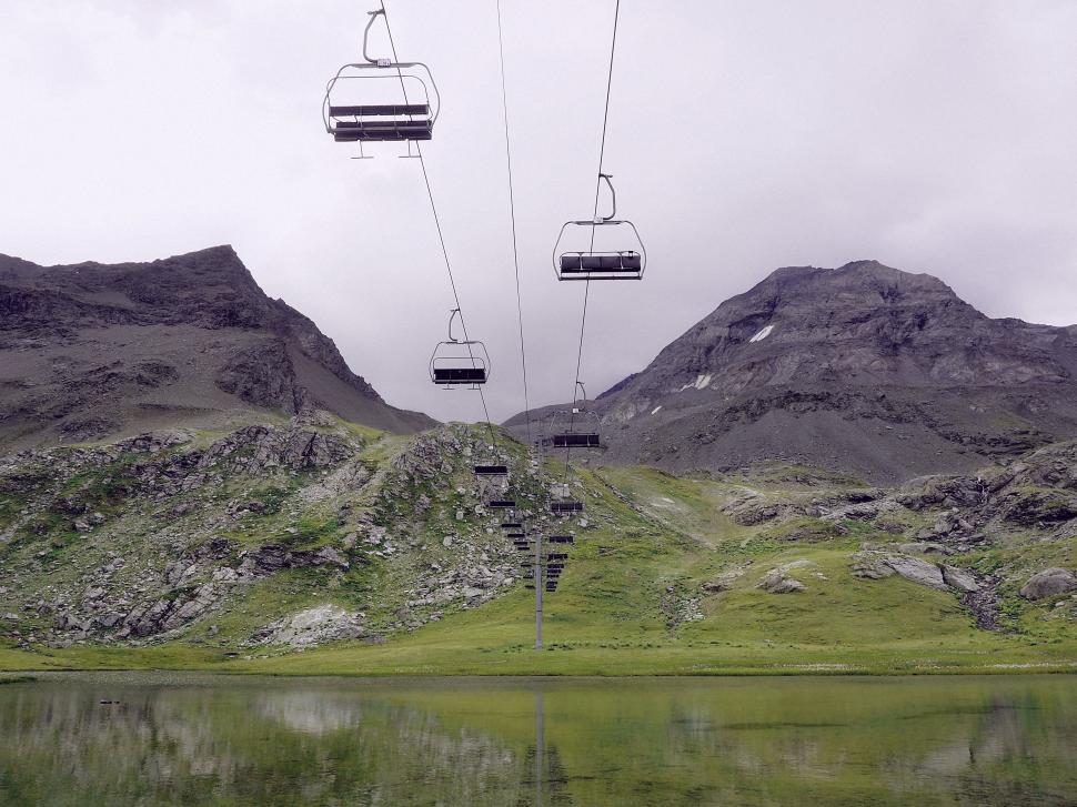 Free Image of Two Ski Lifts Overlooking Body of Water 