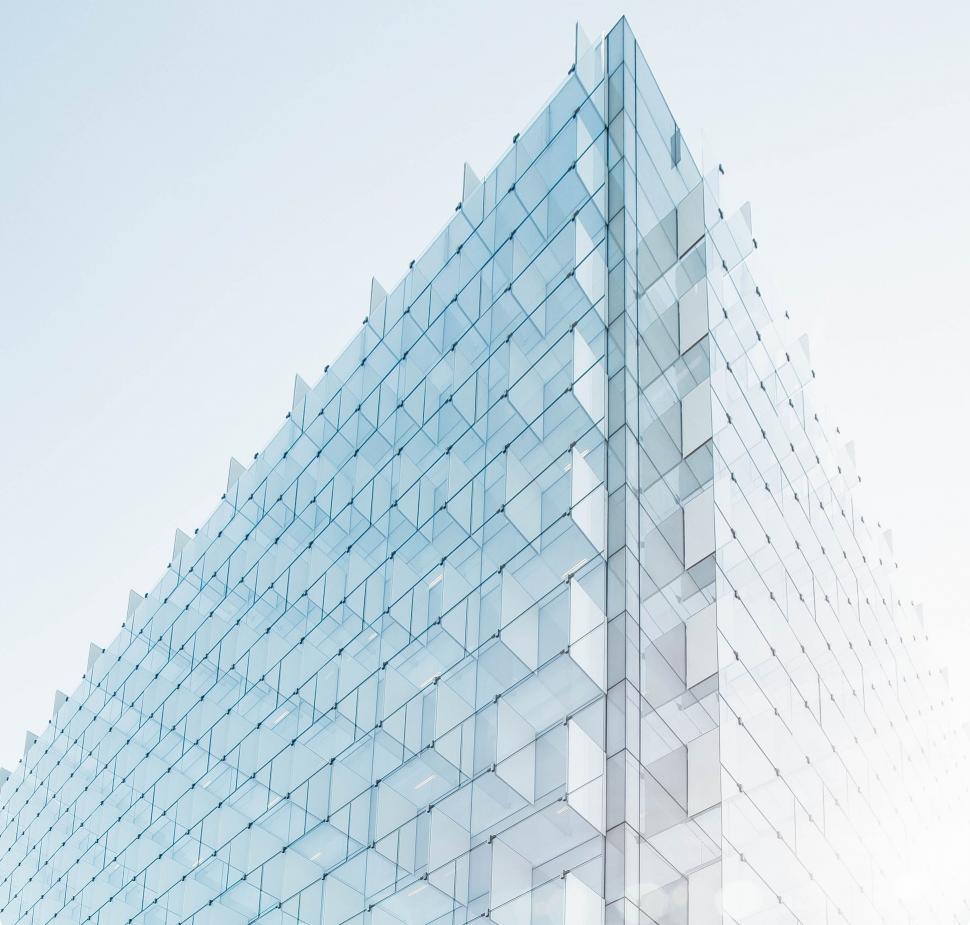 Free Image of Tall Glass Building Against Sky 