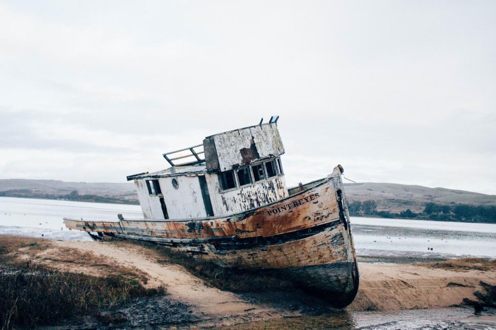 Free Image of Boat Resting on Sandy Beach 