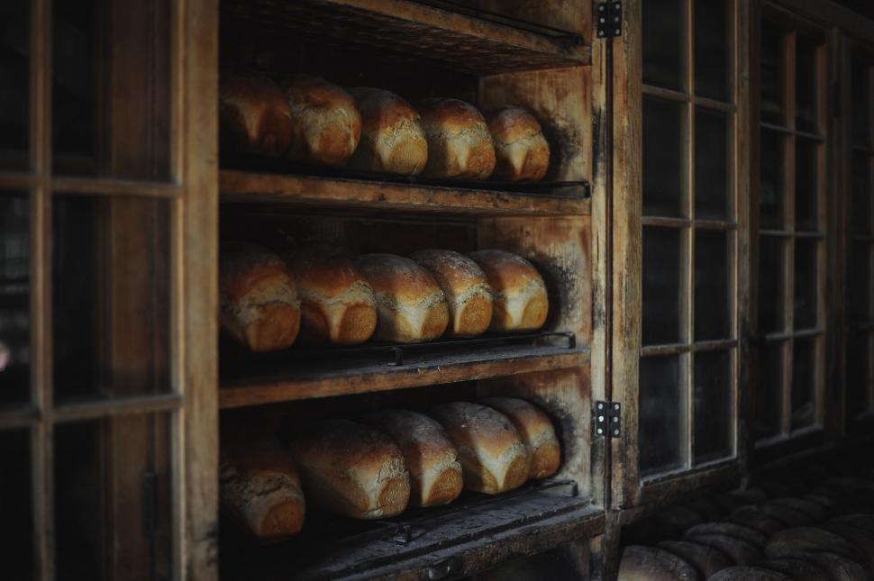 Free Image of Display of Various Breads on a Shelf 